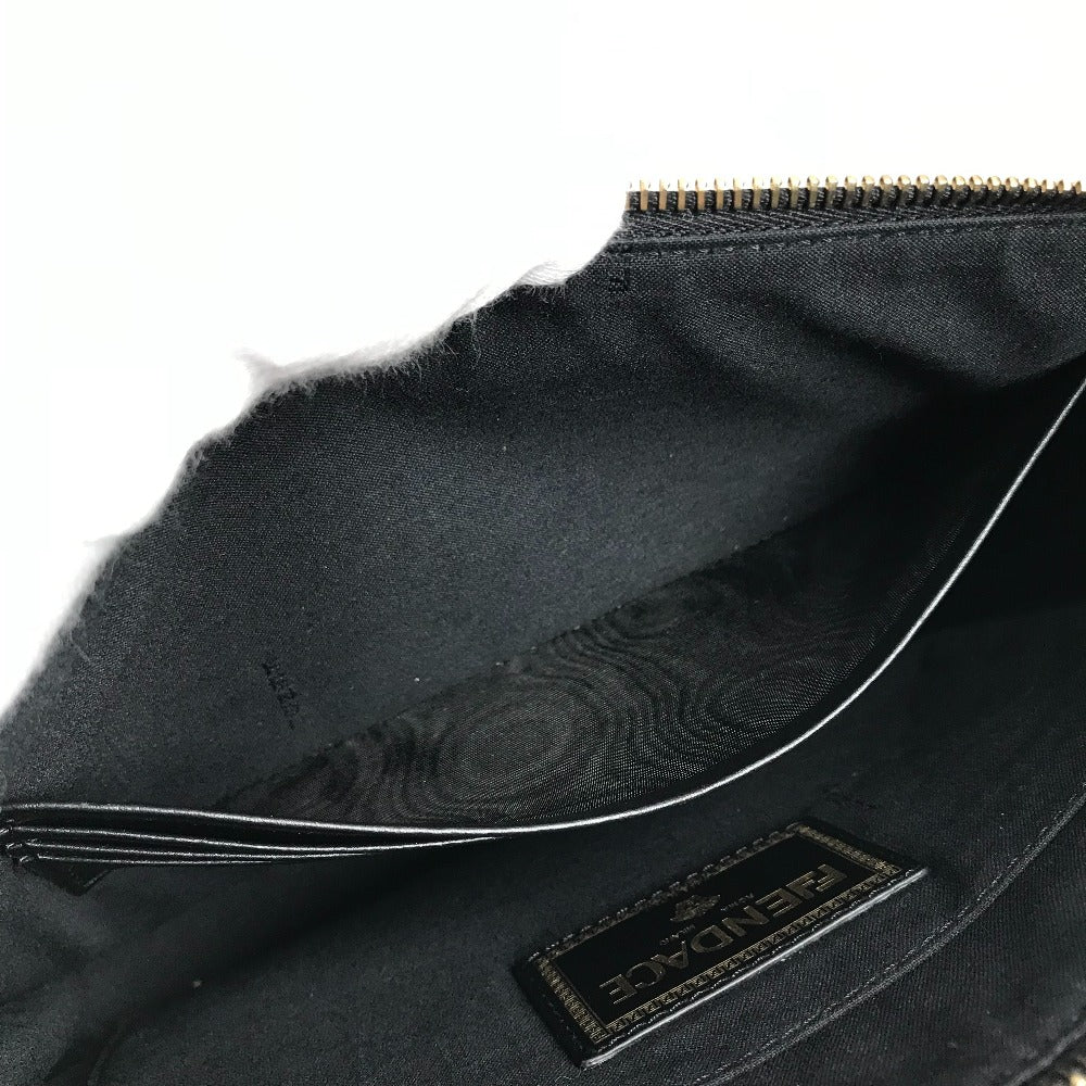 Close-up of a black jacket with a brand label on a white background