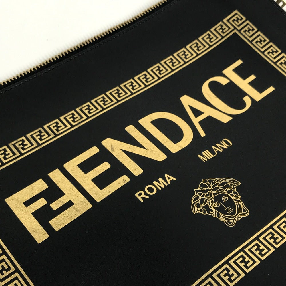 Black pouch with gold 'FENDACE' text and logo, featuring 'Roma Milano'.
