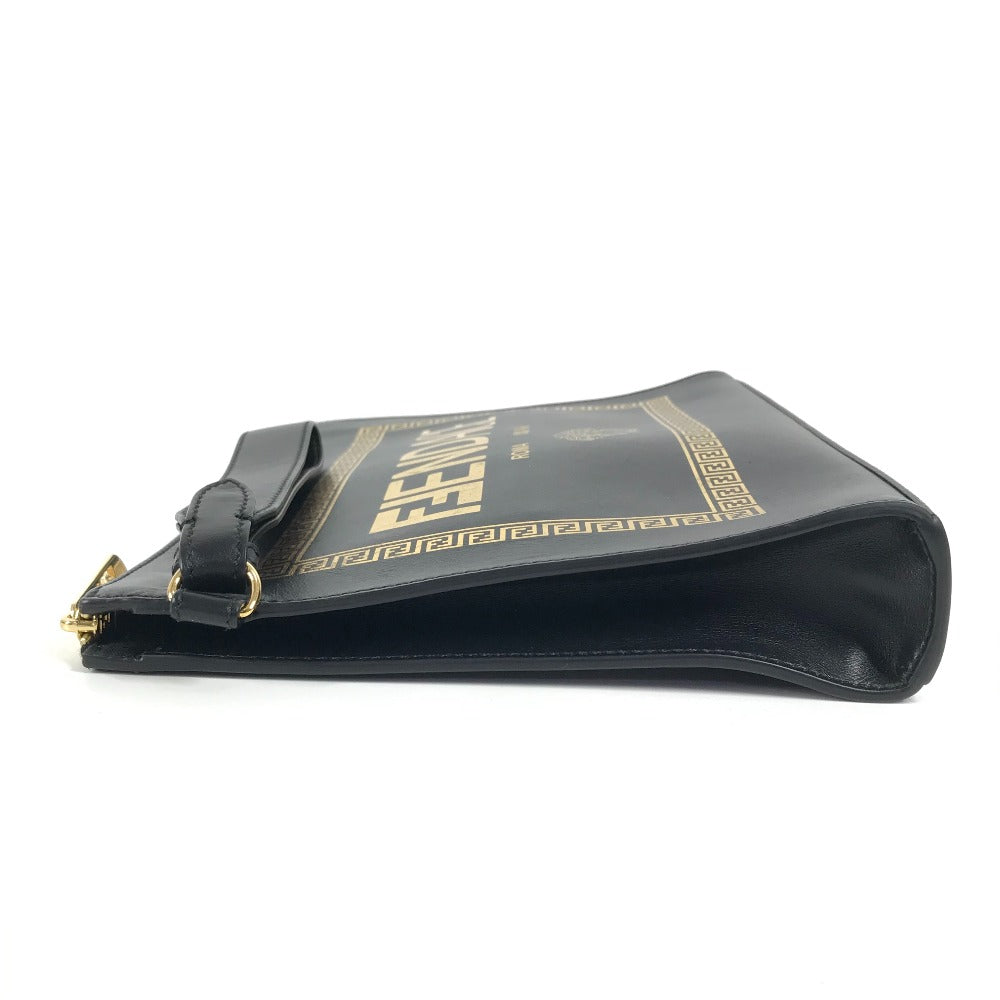 Black handbag with gold accents on a white background
