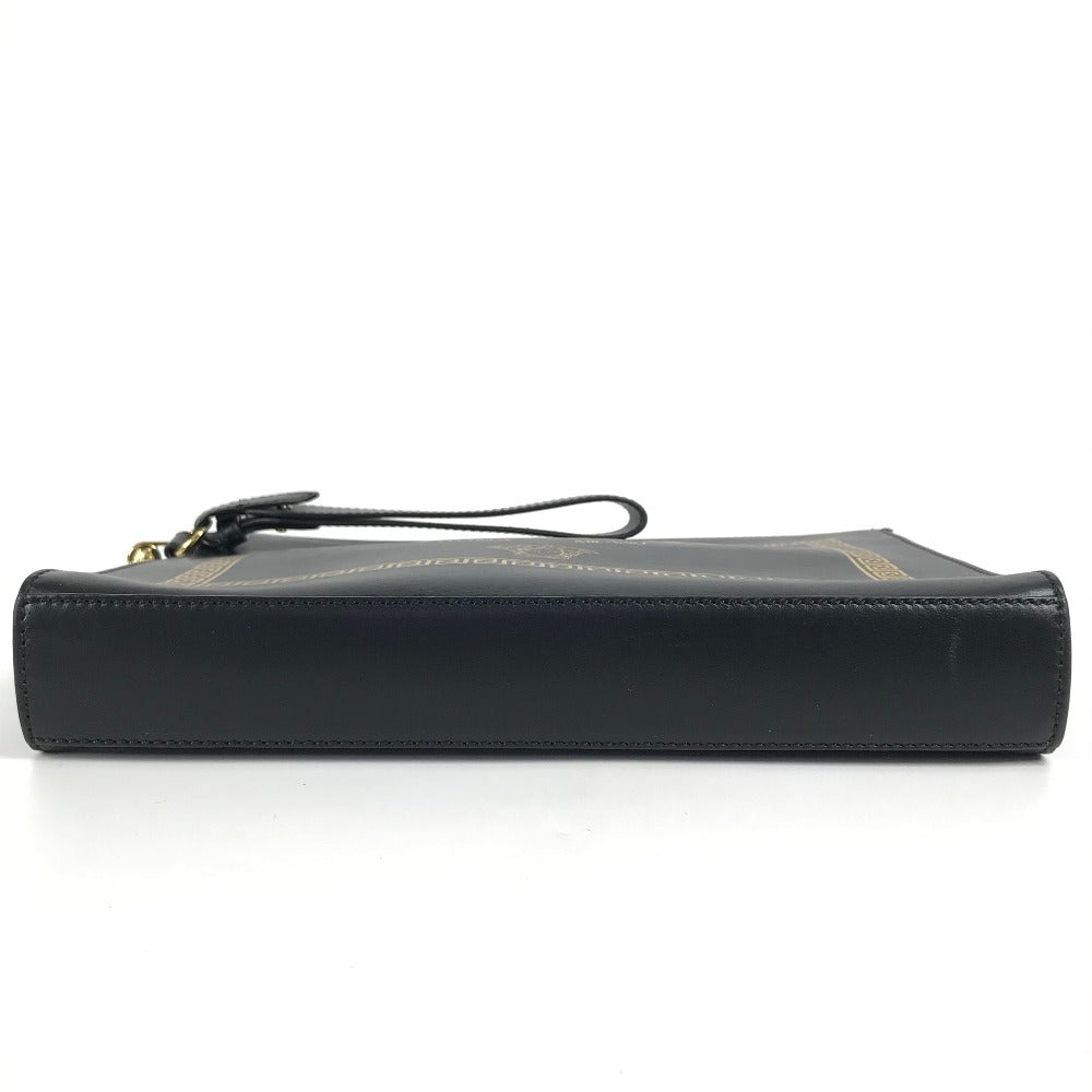 Black leather clutch bag with a strap on a white background