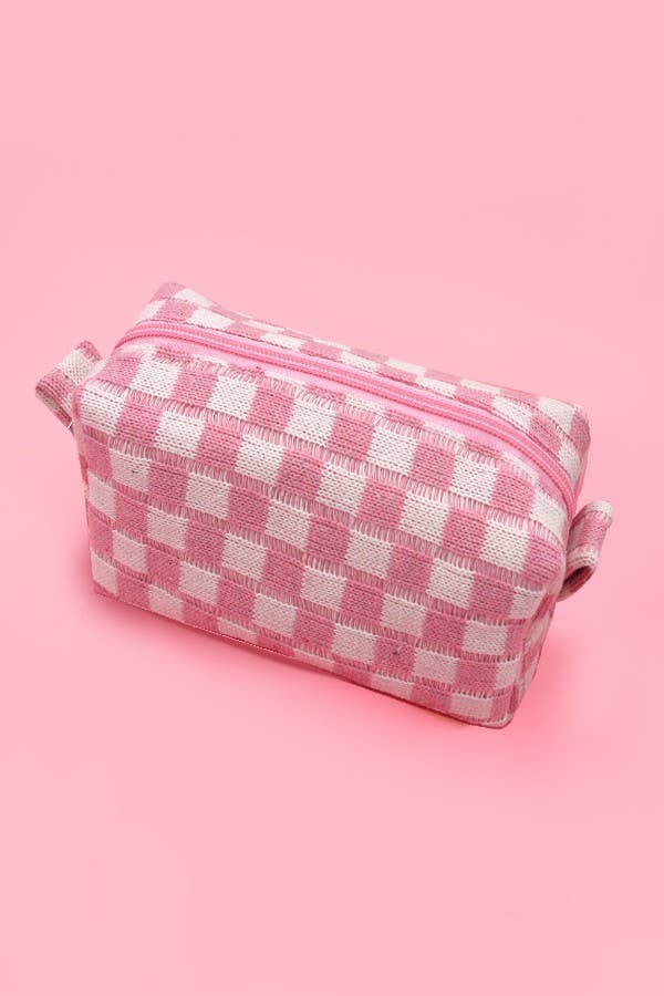 Pink and white checkered pouch on a pink background