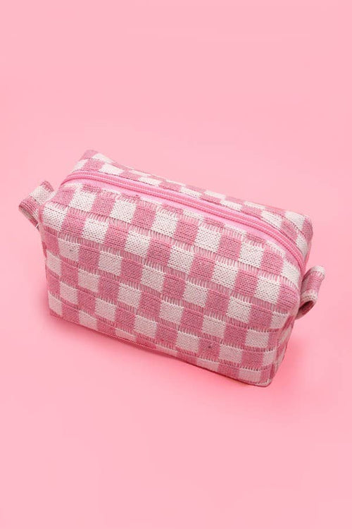 Pink and white checkered pouch on a pink background