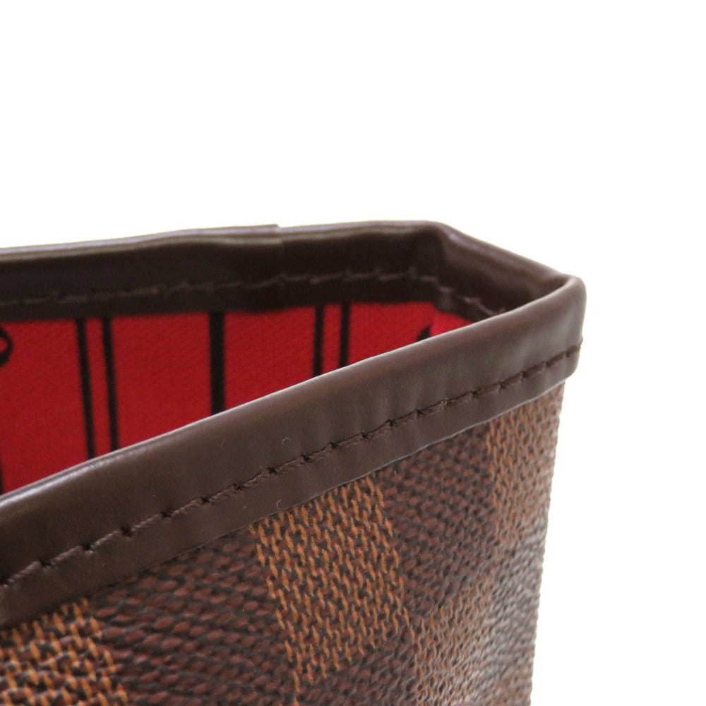 Close-up of a brown textured product with a red interior on a white background
