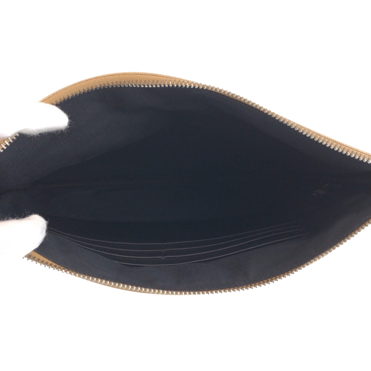 Open black wallet with gold trim on a white background