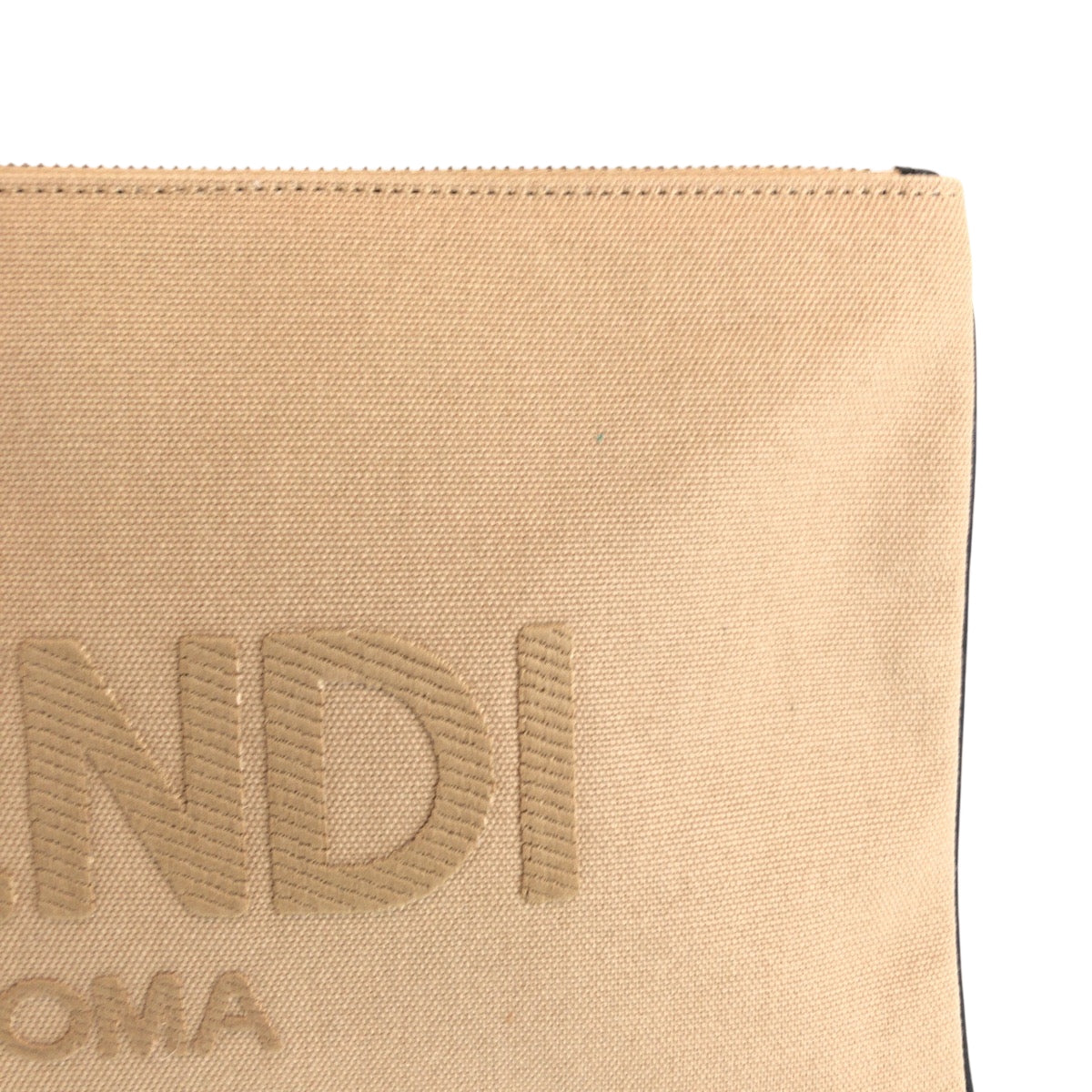 Beige pouch with 'ANDI' branding on a white background