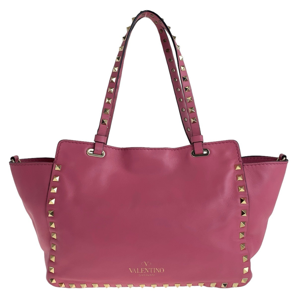 Pink handbag with gold studs on a white background