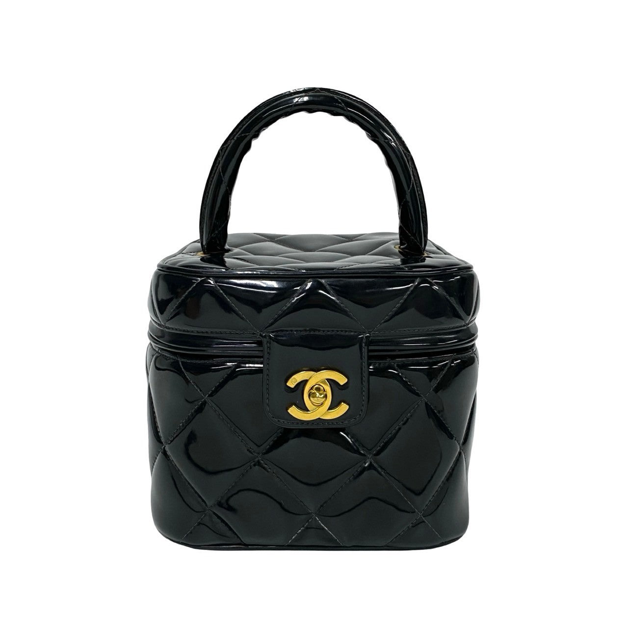 Black quilted handbag with gold Chanel logo on a white background