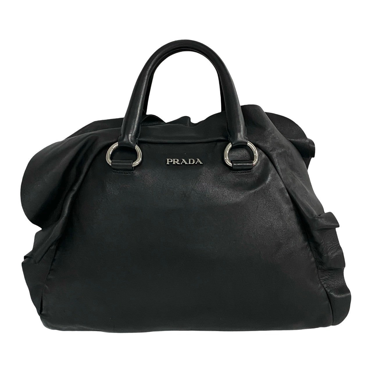 Black Prada handbag on a white background