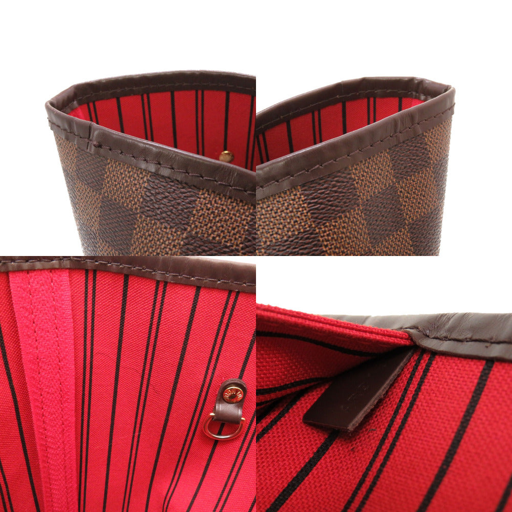 Close-up of a red and black patterned bag with brown accents on a white background