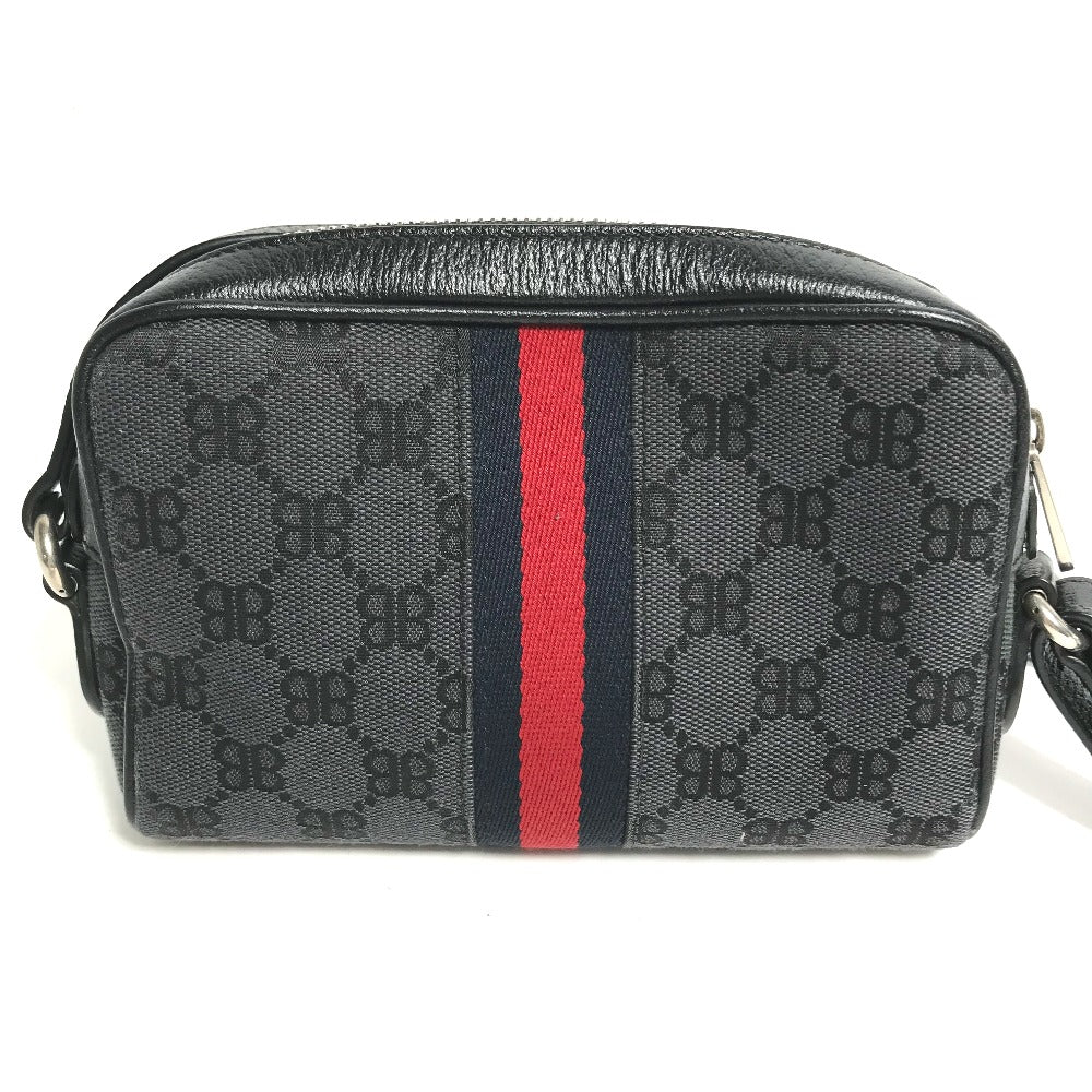 Black patterned bag with a red and blue stripe on a white background