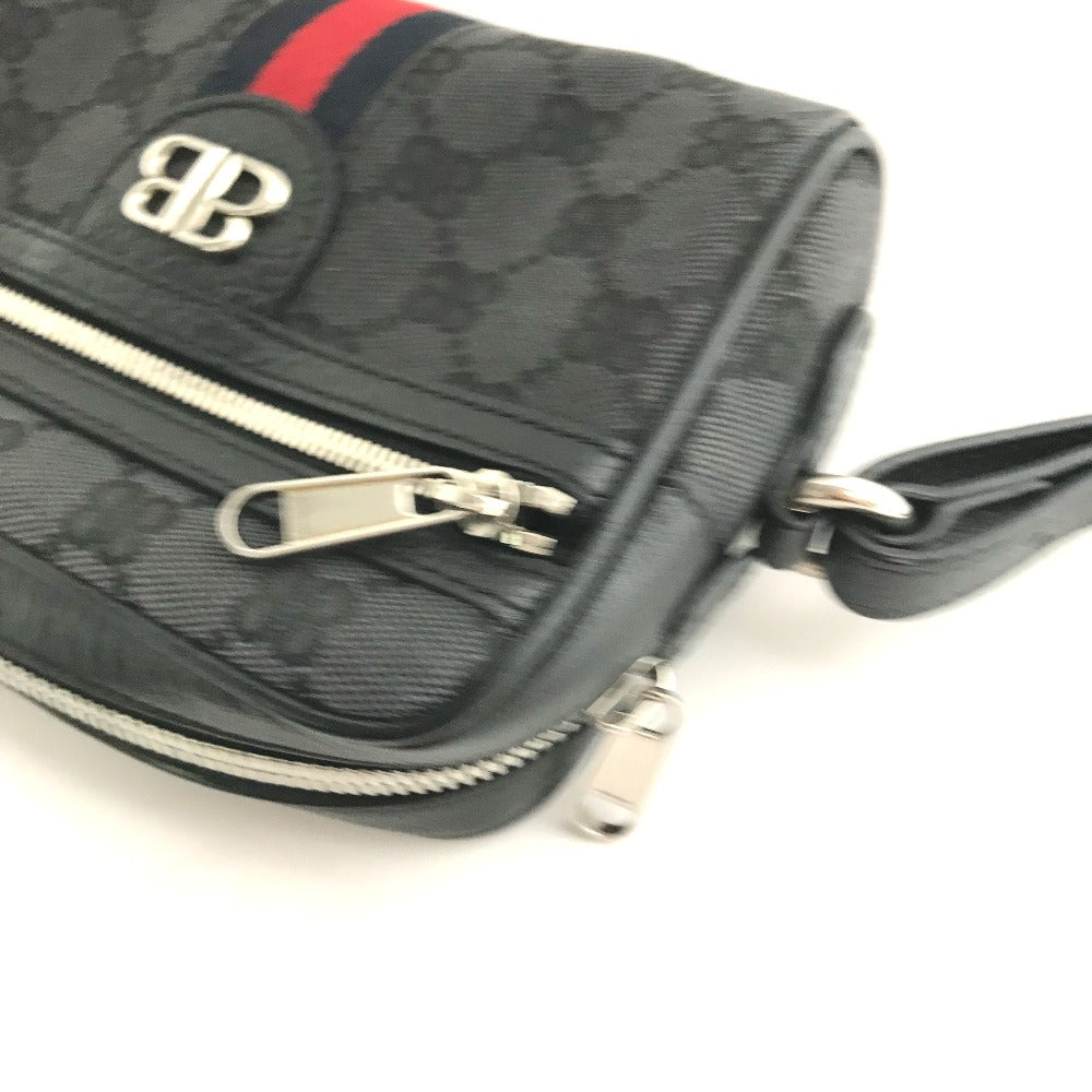 Black patterned handbag with silver zipper and logo on a white background
