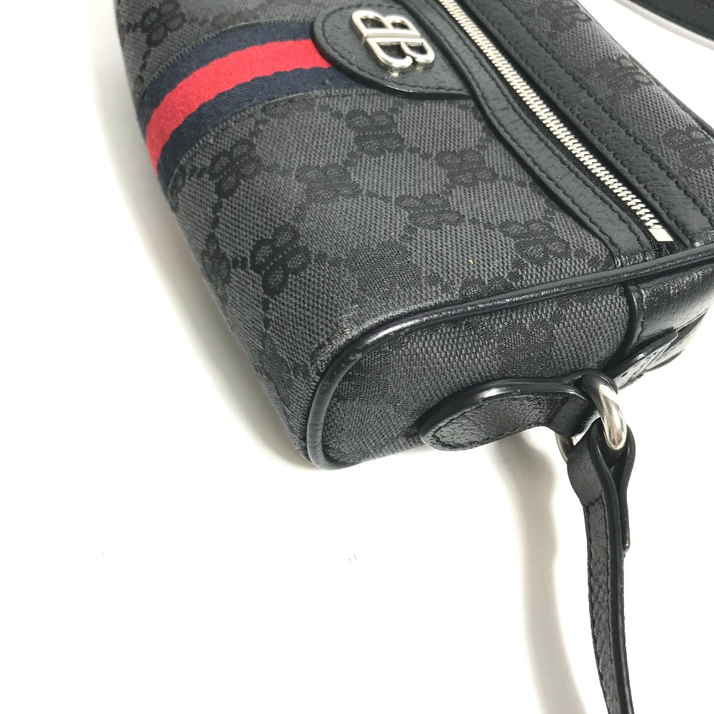 Black patterned handbag with red and blue stripe on a white background