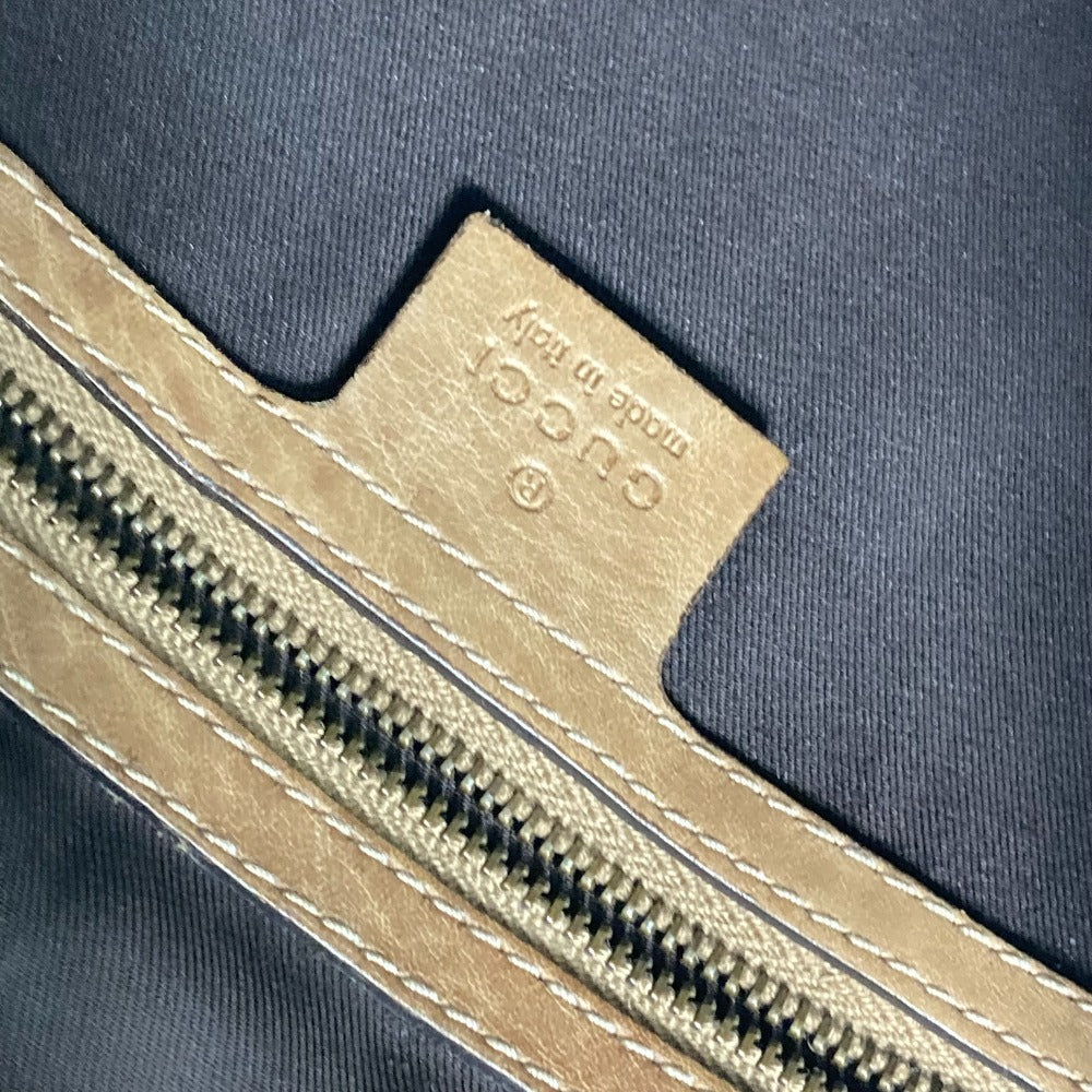 Close-up of a zipper on a dark fabric background