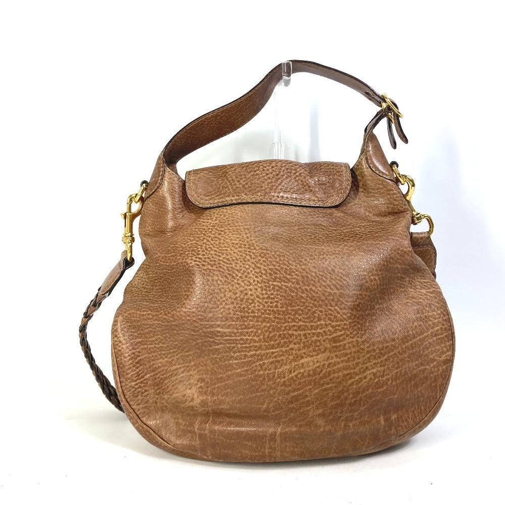 Brown leather handbag on a white background