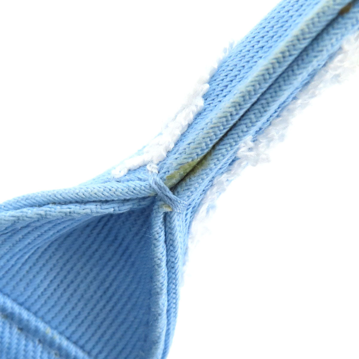 Close-up of blue fabric with a white background