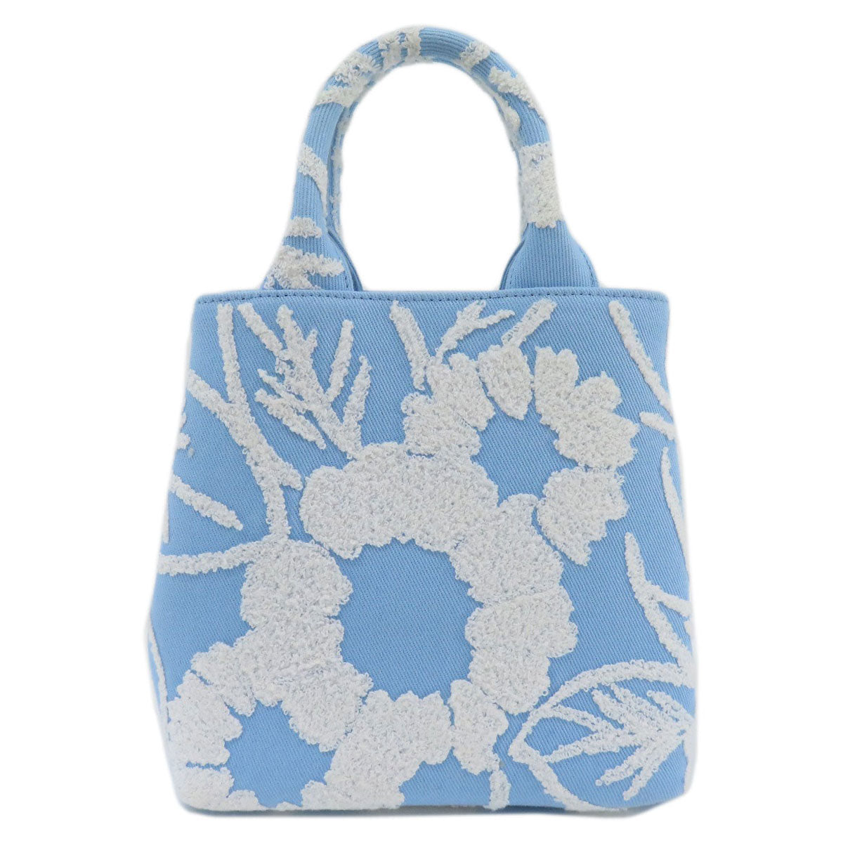 Blue bag with white floral pattern on a white background