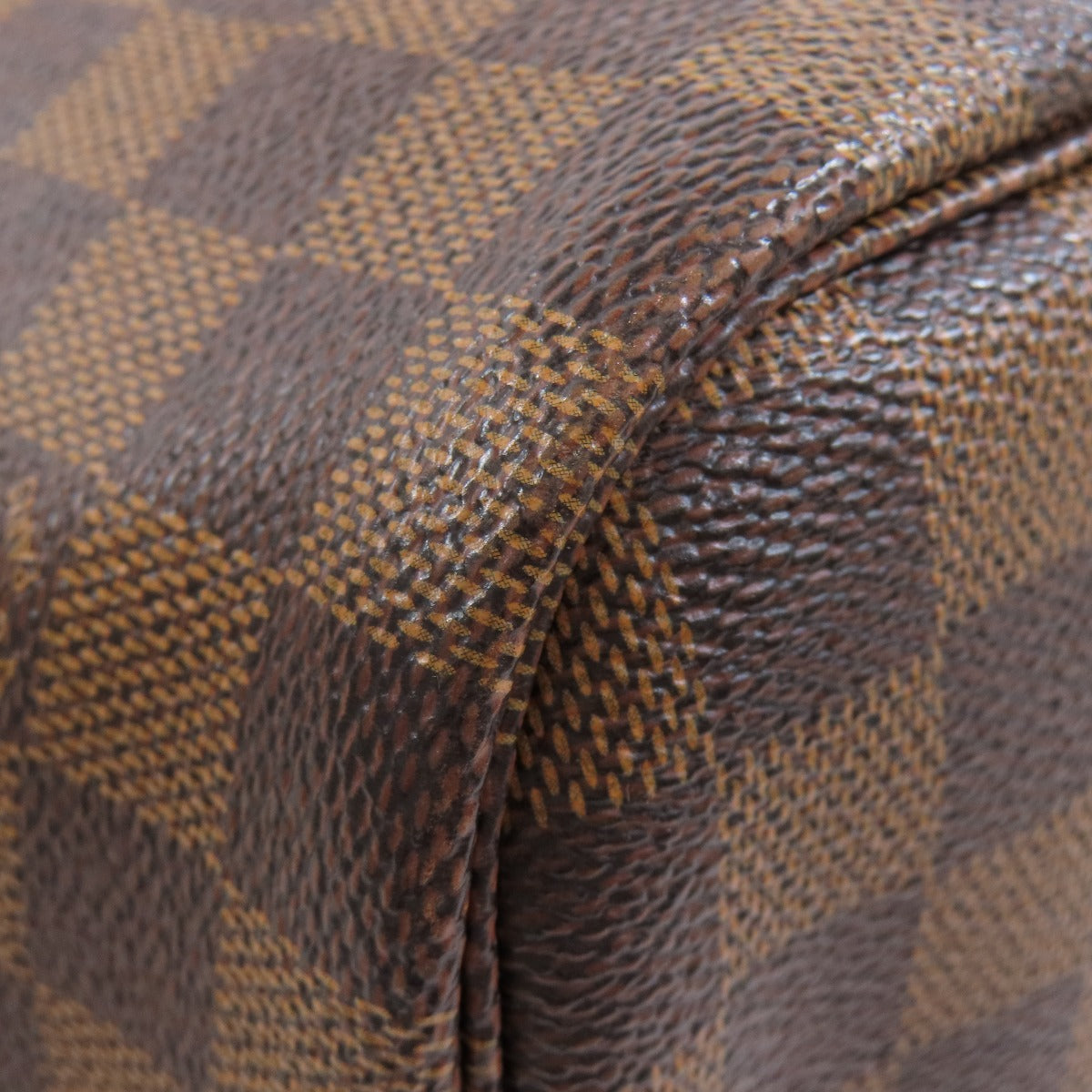 Close-up of a brown and black checkered patterned fabric.