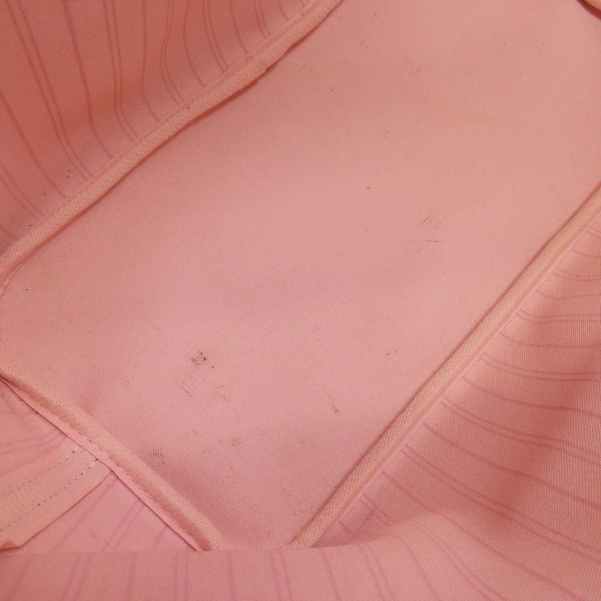 Close-up of a pink textured fabric with a zipper