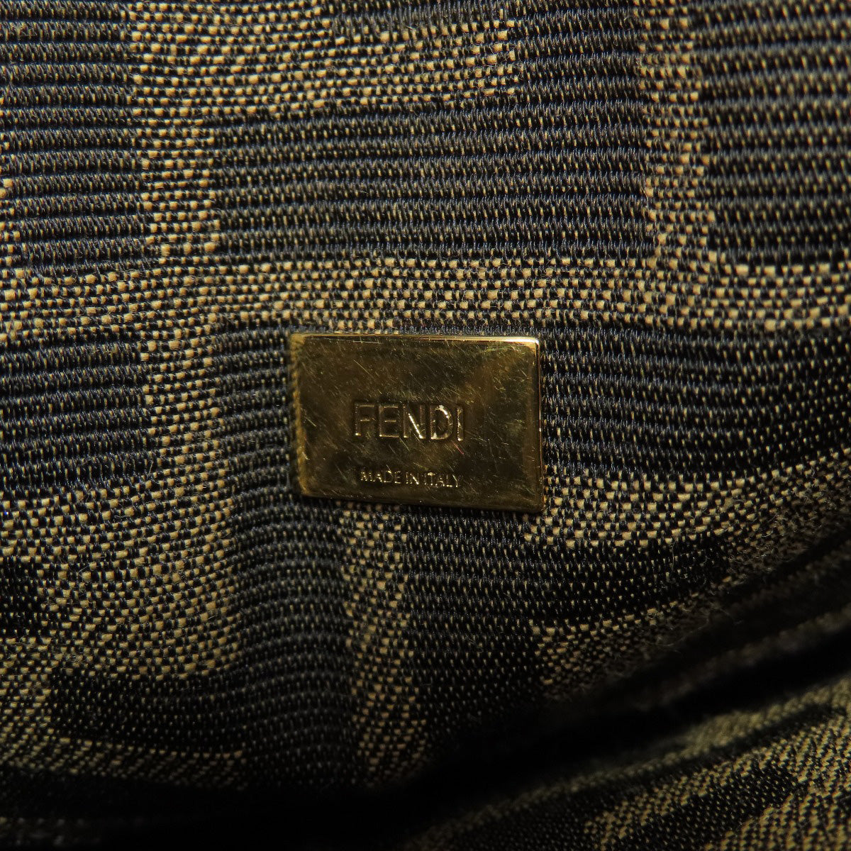 Fendi logo on a textured fabric background