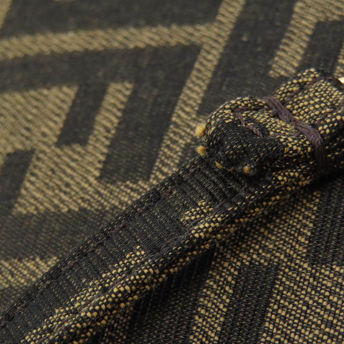 Close-up of a textured fabric with a geometric pattern