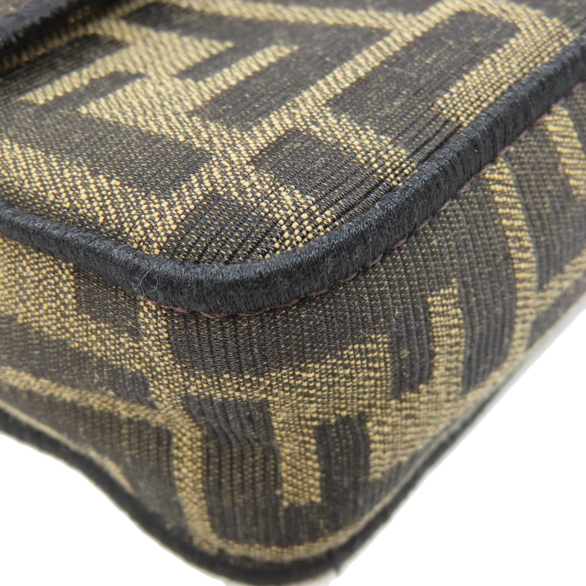 Close-up of a patterned fabric with black and gold design