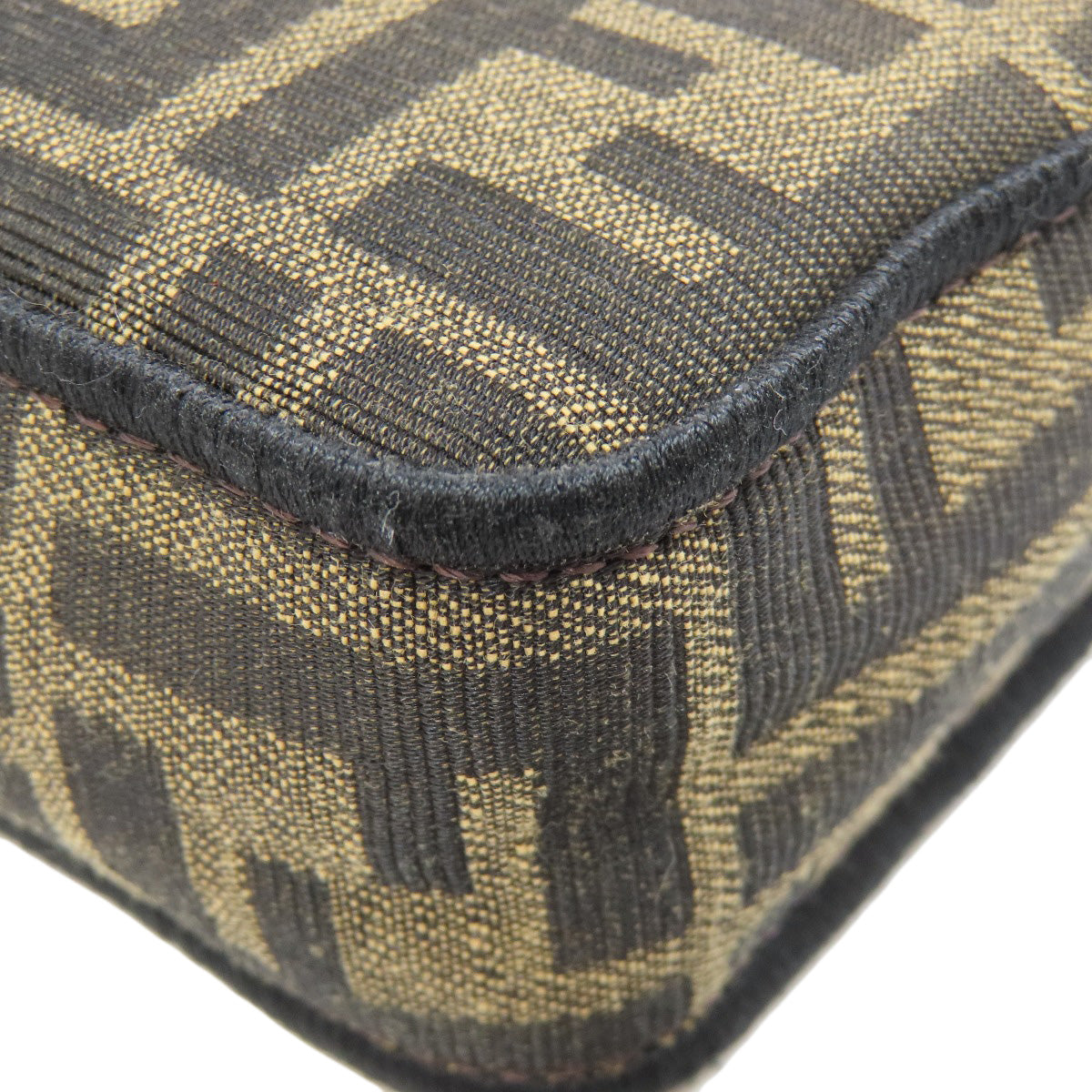 Close-up of a patterned fabric with a geometric design on a white background