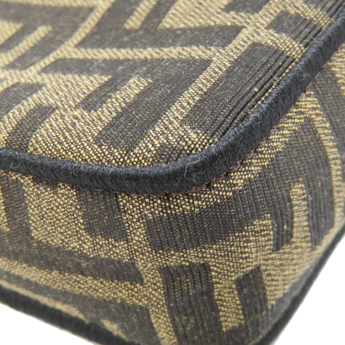 Close-up of a textured fabric with a geometric pattern on a white background