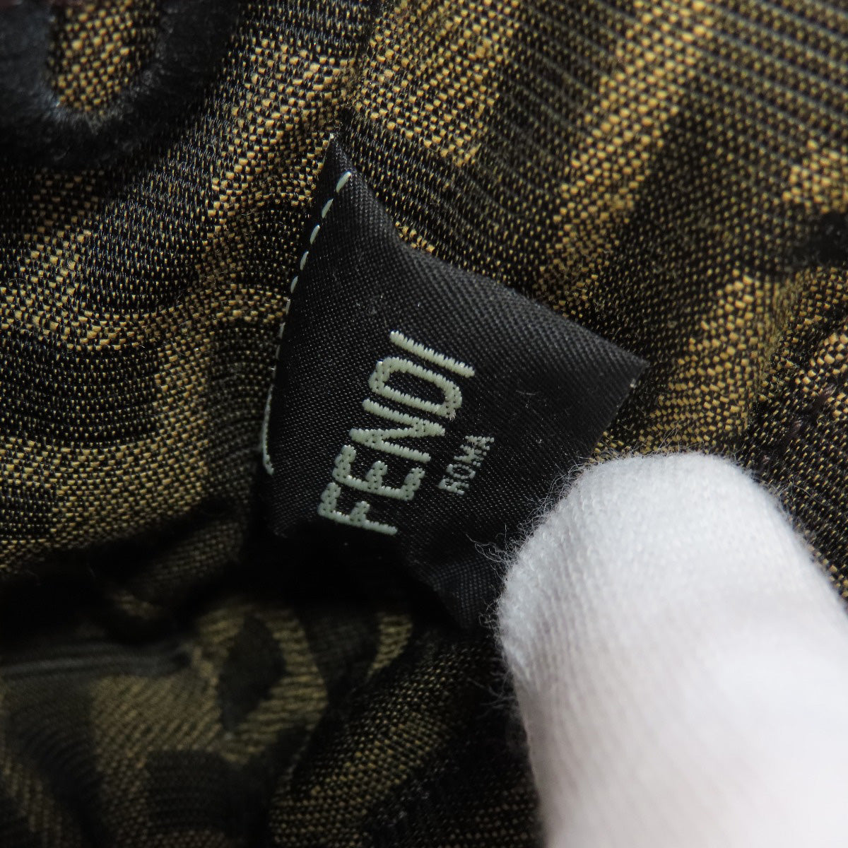 Fendi label on a patterned fabric background