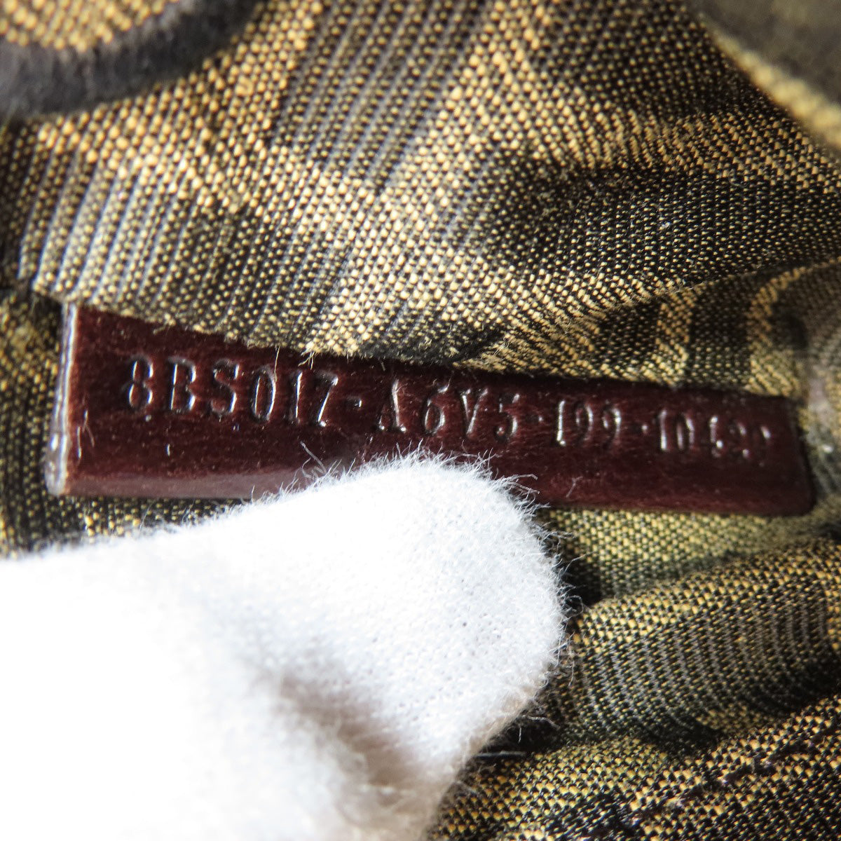 Close-up of a label on a textured fabric background