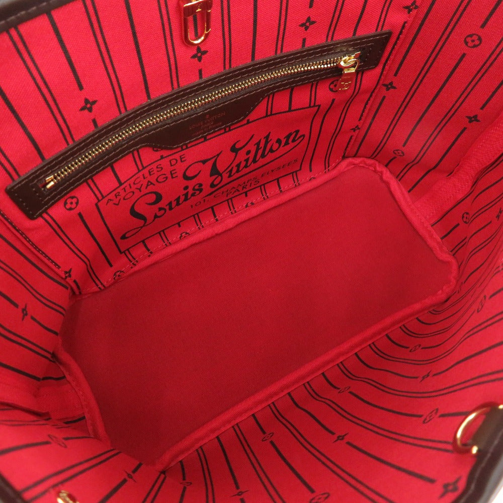 Close-up of a red Louis Vuitton bag with visible branding.