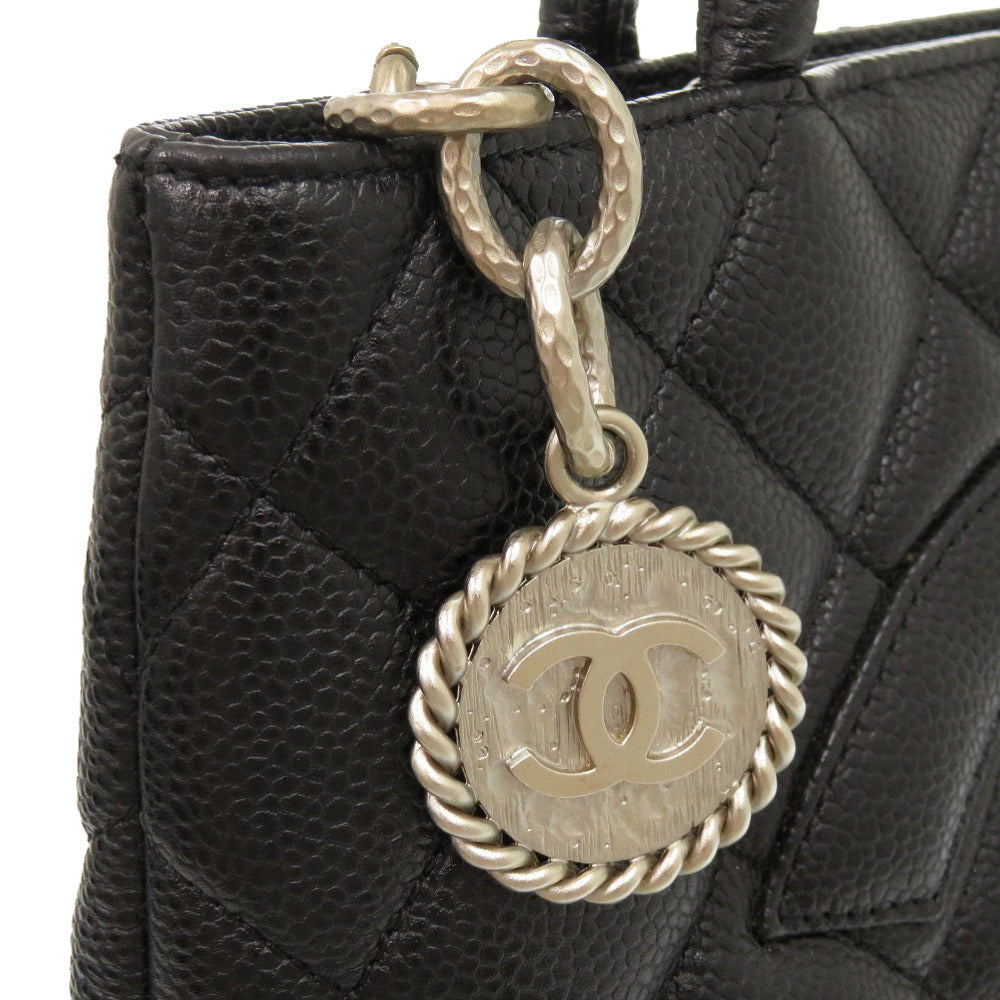 silver medallion Chanel Caviar Quilted Medallion Tote Black 