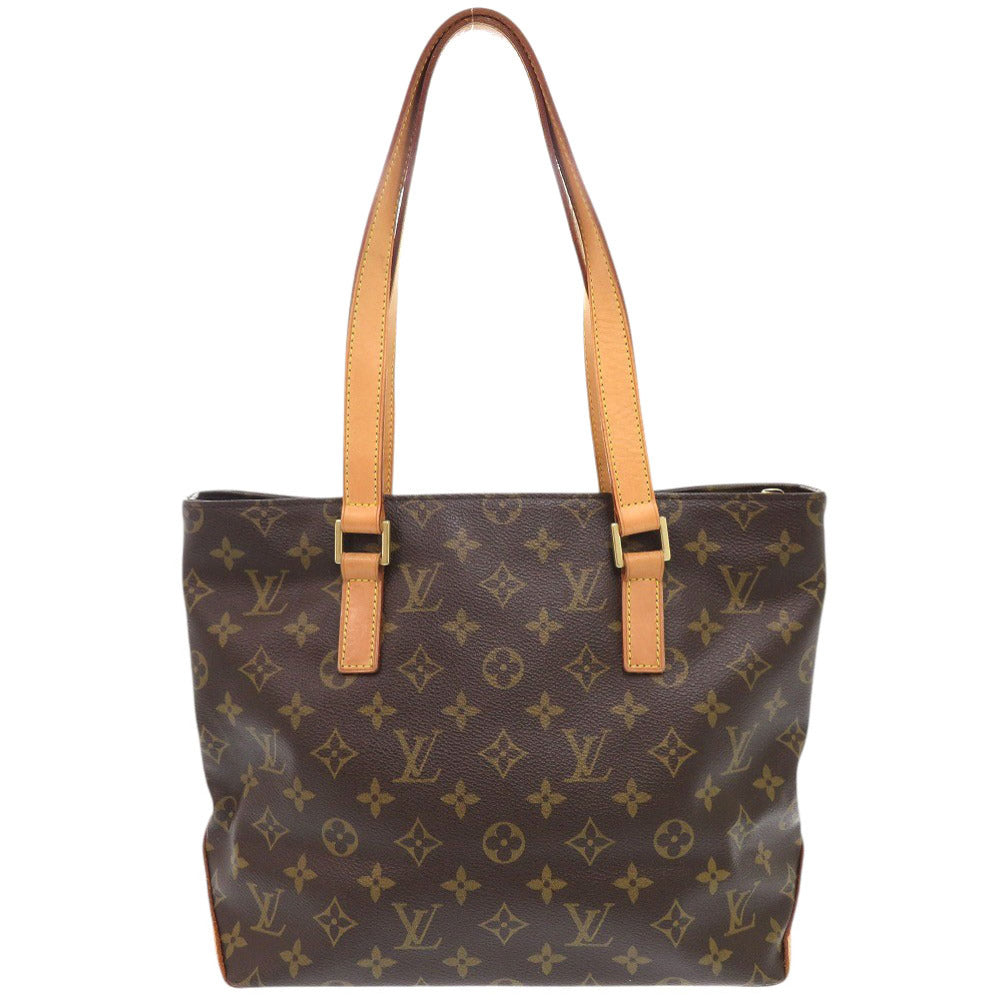 Brown monogram handbag with tan handles on a white background