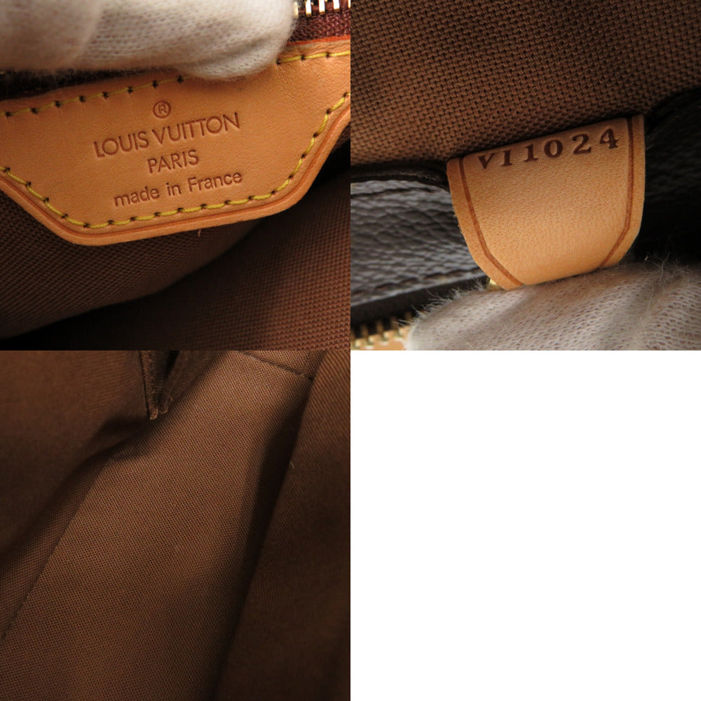 Close-up of a Louis Vuitton bag with brand name and number on leather tag.