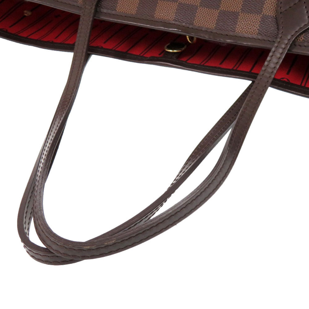 Close-up of a brown leather handbag handle on a white background