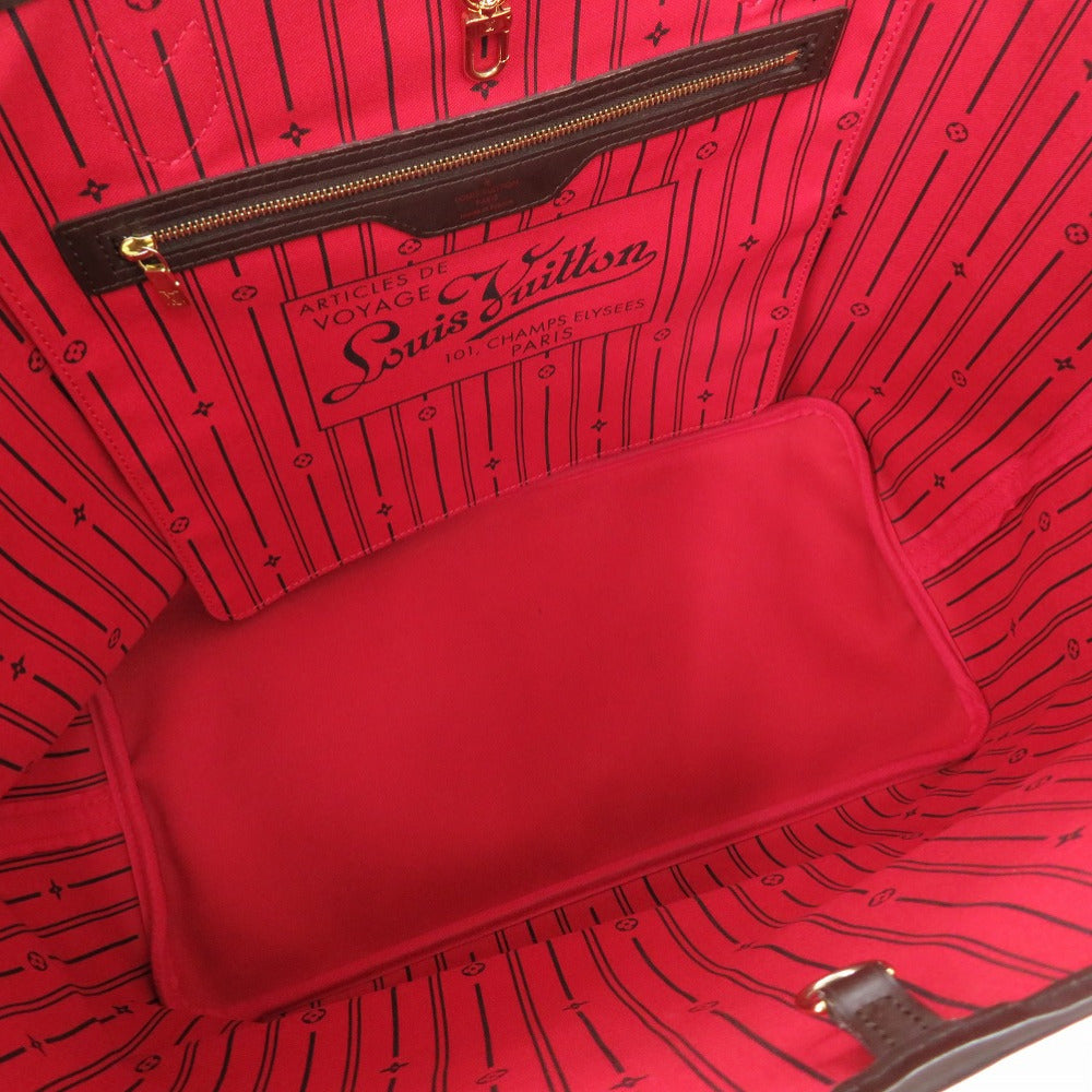 Close-up of a red Louis Vuitton handbag with visible branding.