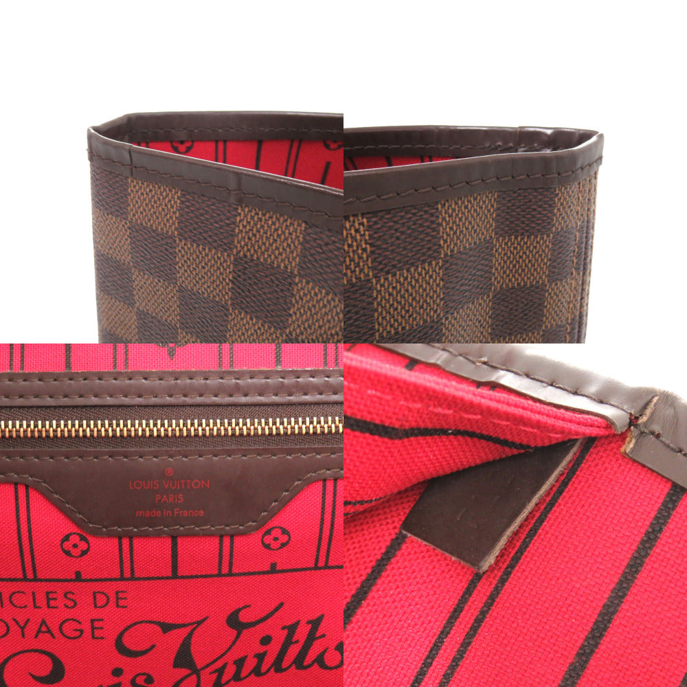 Close-up of a red and brown patterned wallet with visible brand logo.