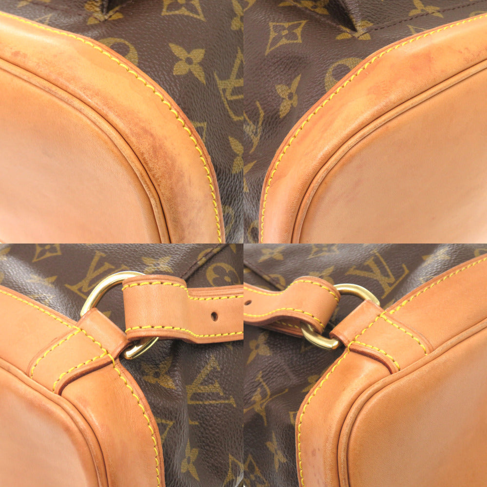 Close-up of a brown leather bag with gold hardware on a patterned background