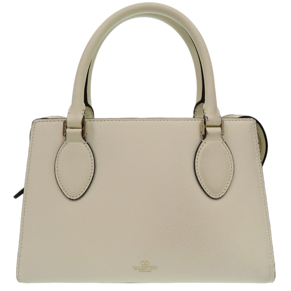 Beige handbag with a visible brand logo on a white background