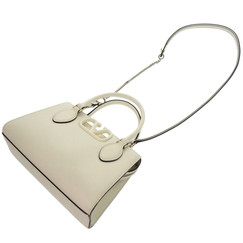 White handbag with a chain strap on a white background