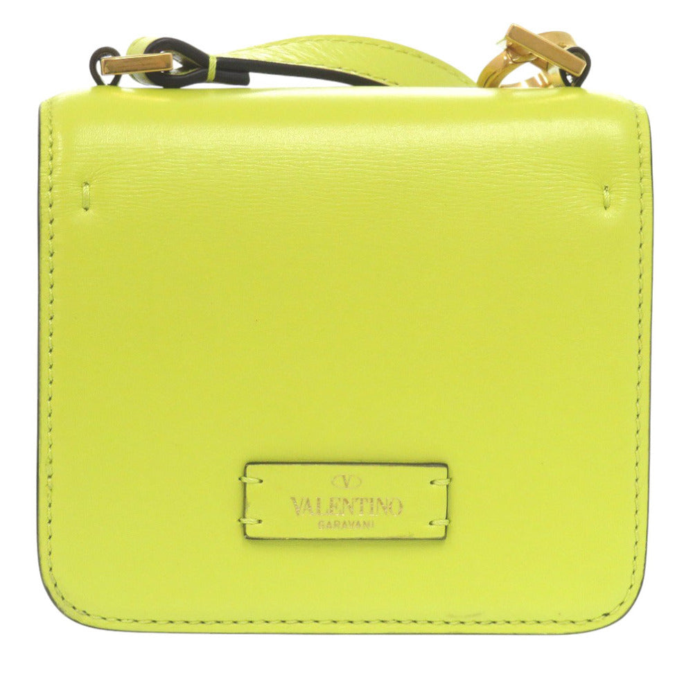 Yellow handbag with a brand logo on a white background