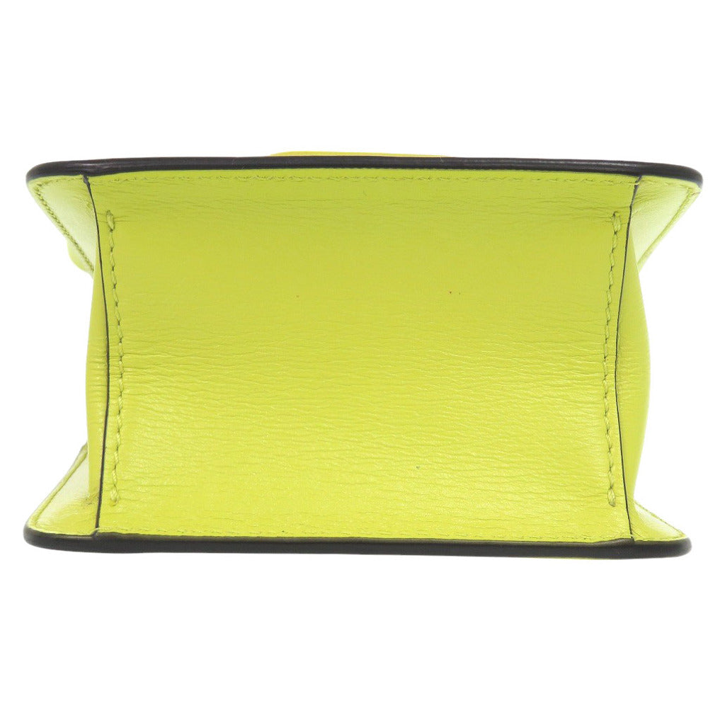 Yellow leather belt with black stitching on a white background