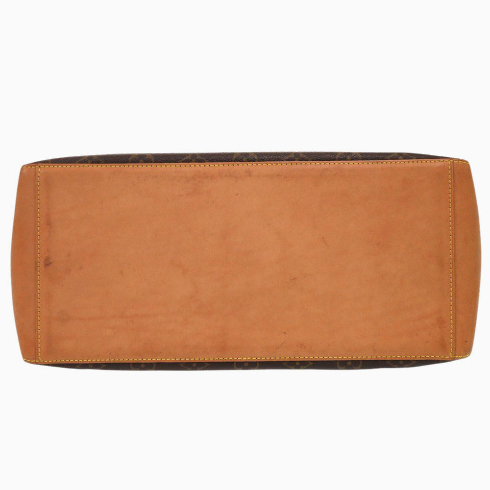 Brown leather clutch bag on a white background