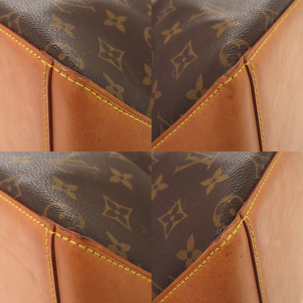 Close-up of a brown leather bag with monogram pattern