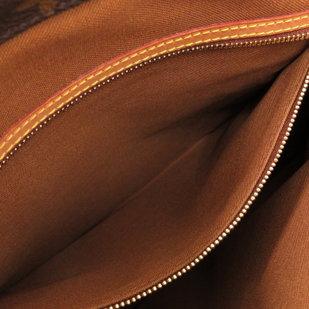 Close-up of a brown fabric surface with visible stitching