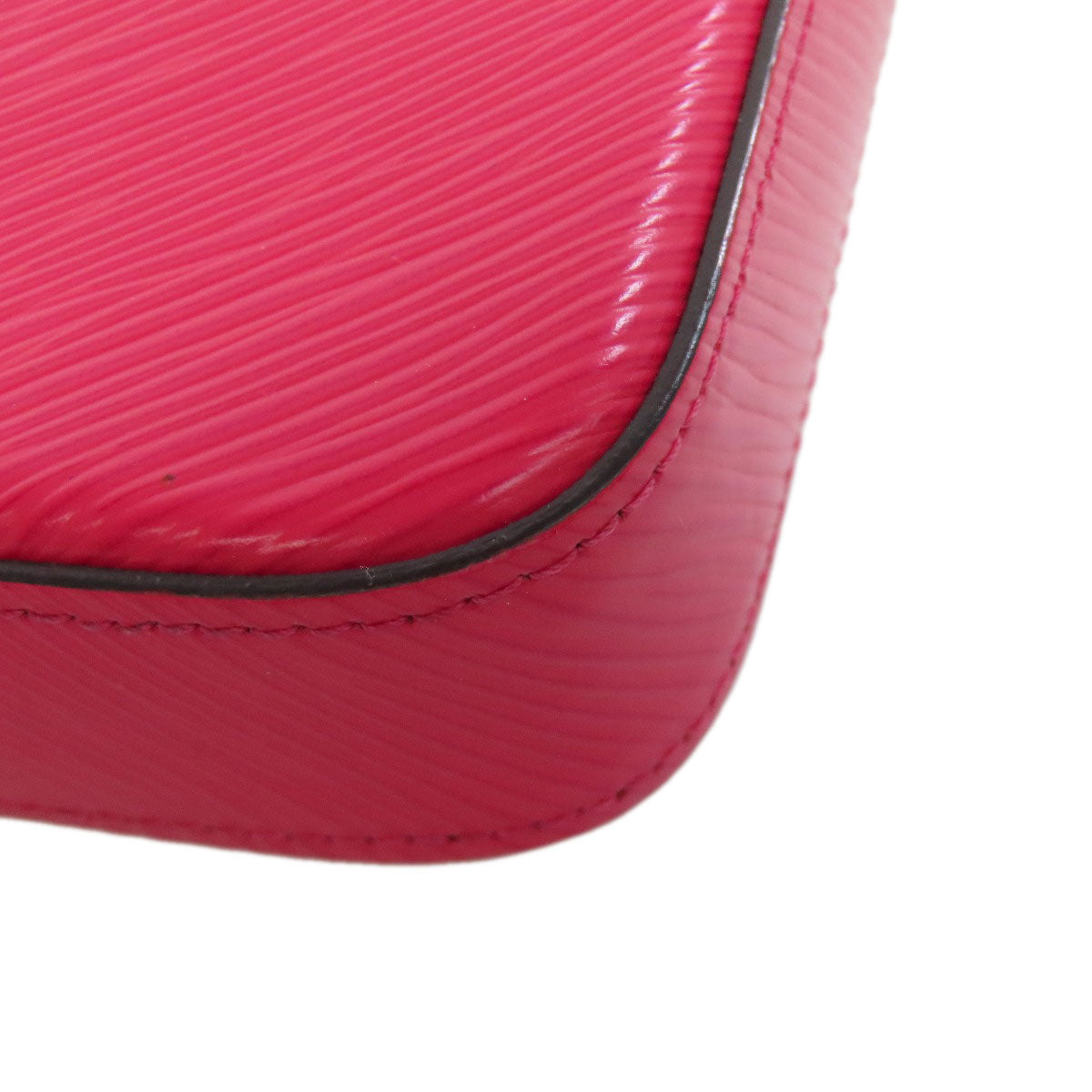 Close-up of a pink textured surface with a white background