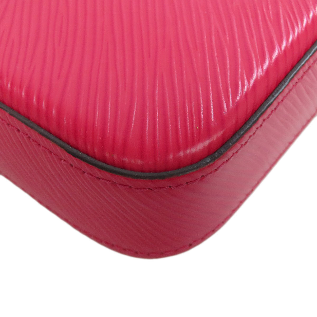 Close-up of a pink textured case with a white background
