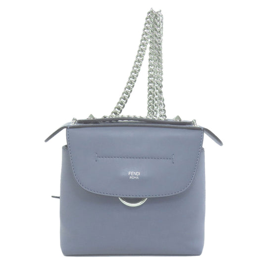 Blue handbag with a chain strap on a white background