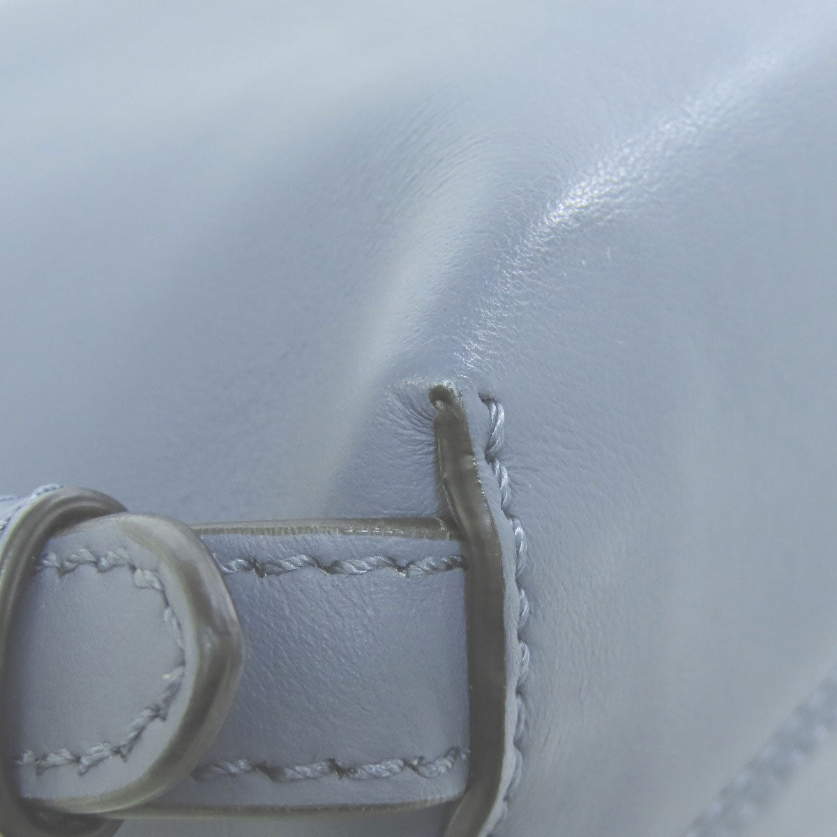 Close-up of white leather with stitching detail