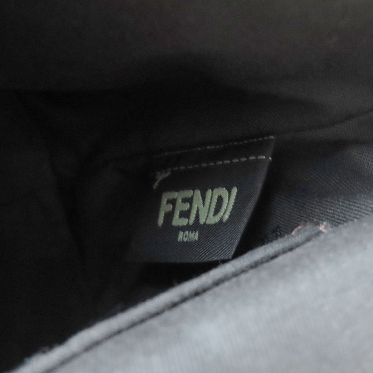 Fendi label on a black fabric background