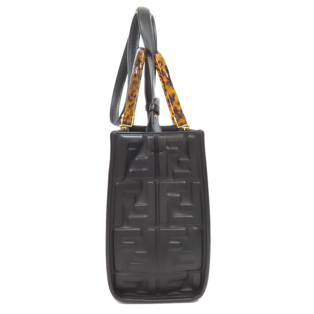 Black textured handbag with tortoiseshell accents on a white background